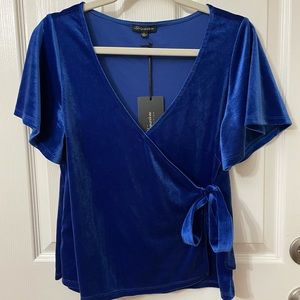 Blue “suede” feel wrap top.